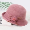 Detailed view of pink faux mink fur winter hat with knit floral and bow embellishments - Flower / Dusty Pink