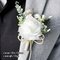 Elegant white rose boutonniere with gold bow and greenery on a gray suit lapel - Ivory