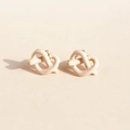 Elegant cream white enamel heart knot stud earrings with polished gold base finish - White