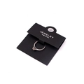 Silver jewelry ring with zircon inlay displayed on black jewelry packaging card - Ring Card Style D 6*10cm (100 Pcs)