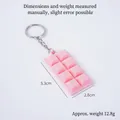 Pink realistic chocolate bar keychain with silver metal ring and chain on white background - With Keychain / Pink