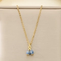 Detail of a gold stainless steel necklace with blue enamel fruit charms on a beige stand - Light Blue Double Bead Fruit Style (KN292107-Z)