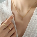Gold titanium necklace with zircon-studded letter J pendant on a delicate chain - Letter J / Gold