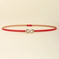 Slim red leather waist belt for women with golden pearl shell buckle on yellow background - Red