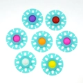 Set of 7 colorful flower-shaped silicone push pop fidget toys with blue outer frames - Blue