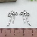 Silver bow hollow pendant charms in alloy for DIY jewelry necklaces and earrings - Hollow Bowknot - Silver (21399)