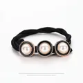 Elegant black twisted hair tie with three pearls and gold-edged black enamel circles - Retro Pearl Style