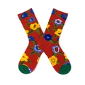 Detailed view of red cotton socks with colorful blue, yellow, and purple floral patterns - One Size / Red Flower