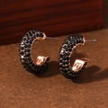 Rose gold geometric C-shaped earrings with black crystals in elegant studio lighting - Black With KC Gold