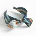 Bohemian silk headband featuring navy and orange chain patterns with knot detail - Navy Blue Chain Bow