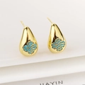 Detail of teardrop earrings with blue clover inlay on white geometric stands - Sky Blue
