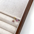 Sparkling pink purple gemstone stud earrings with gold screw backs on a display box - Colorful Rose Red Round (6mm)