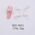 Silver hollow bow nail art charms with dimensions 17x8.5mm for DIY manicure design - Silver Bowknot-9651