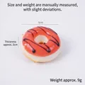 Pink artificial donut model with chocolate drizzle decoration, 5cm diameter size - Red