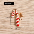 Detail view of candy cane pendant with gold bow and dimensions 22mm by 15mm - Candy Cane Style (YD596)