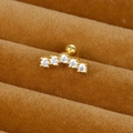 Clou d'oreille en acier doré avec cinq zircons blancs de tailles dégressives - Arc à 5 pierres / Or
