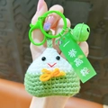 Exquisite handmade knitted green Zongzi keychain featuring a decorative bell and charm - Crochet Zongzi / Green