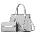 Detail view of grey faux leather handbag set with stylish golden geometric line accents - Light Gray