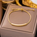 Pulsera ajustable de acero dorado con barra pulida grabada LOVER DREAM para mujer - Pulsera Ajustable con Grabado LOVER DREAM (E144) / Dorado