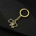 Detail of golden stainless steel Ukraine map keychain with trident emblem on dark background - Map with Emblem / Gold
