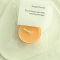 Single light orange scented tealight candle in transparent packaging with card header - Orange (Blood Orange)