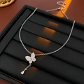 Detailed close-up of a silver butterfly pendant necklace with zircon and teardrop gemstone - 15# Simple Butterfly Zirconia Teardrop Necklace