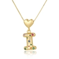 Macro shot of gold letter I pendant with heart clasp and colorful zircon stones - Letter I
