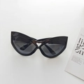 Oversized black cat eye sunglasses with heart-shaped cutout detail and dark lenses - Black
