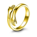 Minimalistischer goldener Ring mit umarmenden Händen und verstellbarem Design für Damen - Gold