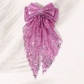 Vue détaillée du grand nœud papillon à paillettes roses avec de longs rubans élégants - rose fuchsia