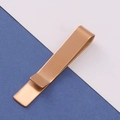 Macro detail of a minimalist rose gold tie clip featuring a matte brushed metal finish - Mirror Rose Gold Tie Clip