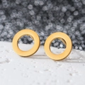 Close-up of minimalist 18K gold hollow circular stud earrings in polished stainless steel - Hollow Round / Gold