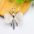 Butterfly ornament with silver metal frame and two heart-shaped pink crystal stone wings - White K Plated Clear Quartz