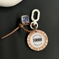 Beige Monte Carlo 10000 poker chip keychain with blue dice and brown silicone ring - Beige Chip 10000 With Blue Dice Keychain (CS001-10000)