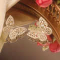 Detailed view of hollow butterfly earrings with micro-inlaid zircon in gold finish - 14K Gold White Zirconia