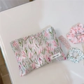 Detail of floral tapestry makeup bag showing textured flower patterns and zipper closure - Green Pink Sprigs