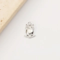 Close-up of a silver stainless steel owl pendant with inlaid eyes on a stone base - Owl Shape (7#) / Silver