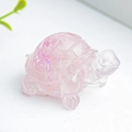 Pink natural crystal resin turtle figurine with sparkling inclusions on a white surface - Rose Quartz + Sequins