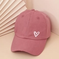 Detail of dusty rose cotton baseball cap featuring white heart embroidery and twill texture - Adjustable / Deep Pink