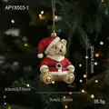 Orsetto natalizio dorato con abito da Babbo Natale rosso e brillantini, alto 10,5 cm - Stile orso