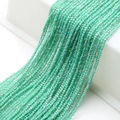 Detail view of faceted mint green glass beads arranged in elegant multi-strand cascades - Water Green Half AB