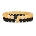 Macro view of 8mm natural stone elastic bracelets with matte black and yellow tiger eye beads - Topaz + Matte Black Agate