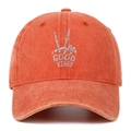 Detail of Good Vibes hand gesture embroidery on orange washed cotton baseball cap - One Size / Orange