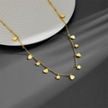 Minimalist gold necklace with dangling heart and star charms on an elegant white ceramic tray - Gold Heart + Star (B216) / Gold
