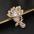 Elegant gold flower brooch with white round rhinestones and a large teardrop stone - XD11096 Golden Floral Rhinestone