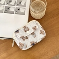 White quilted coin purse with brown teddy bear pattern on a cozy wooden desk - Polka Dot Bear