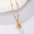 Gold plated conch shell necklace with dainty beads and fine metallic link chain - Spiral Shape Conch Pendant