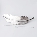 Silver feather metal hair clip showing 9.6cm length dimension and detailed texture - Silver Leaves