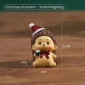 Miniature resin hedgehog with Santa hat and teal cup, cute 5.5cm Christmas desktop decor - Hedgehog (Kraft Box)