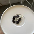 Close-up of a black acrylic flower hair clip with white polka dots on a white surface - White Polka Dot Hollow Flower Style (HDJ-11) / Black Traceless Clip / Black